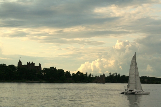 the sun dipping behind boldt castle