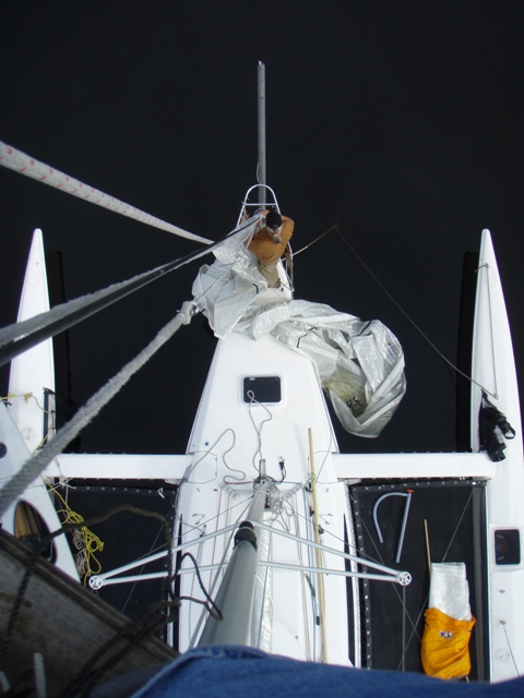 Ken aloft unfouling the jib halyard